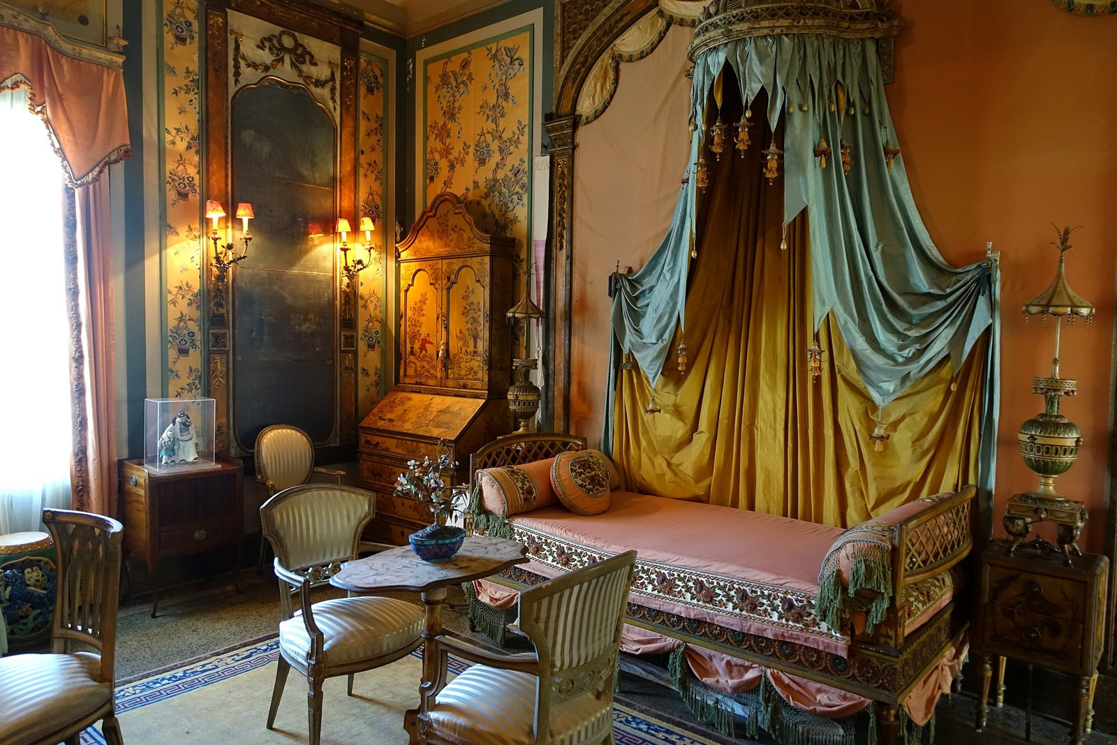 Vizcaya Cathay Bedroom with canopied bed, painted panels, and patterned textiles